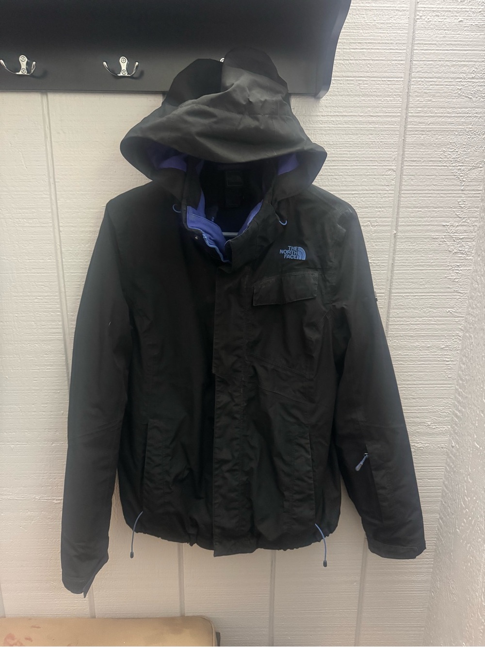 The North Face women’s Black winter with Purple Lining